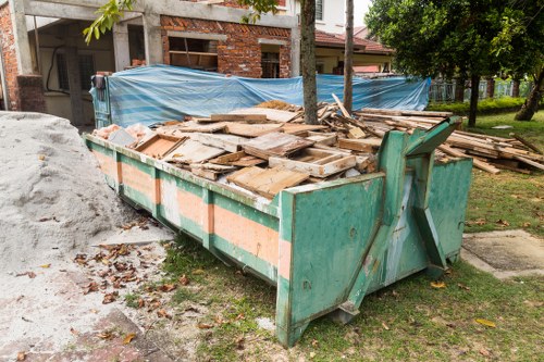 Professional team assessing garage for clearance in Hampstead